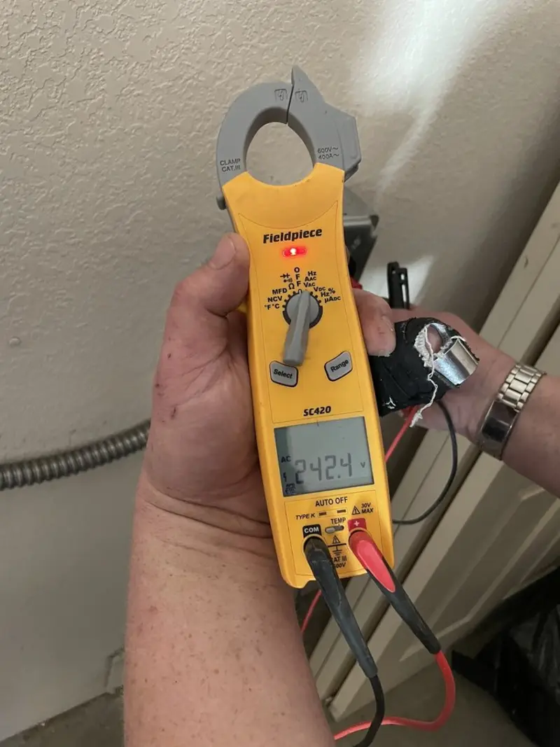 Voltage testing with clamp meter during Recessed Lighting Installation in Pewaukee